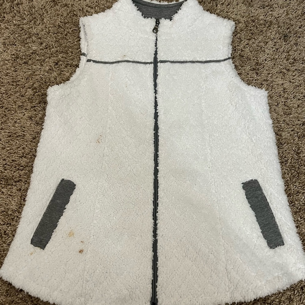 white fuzzy vest
